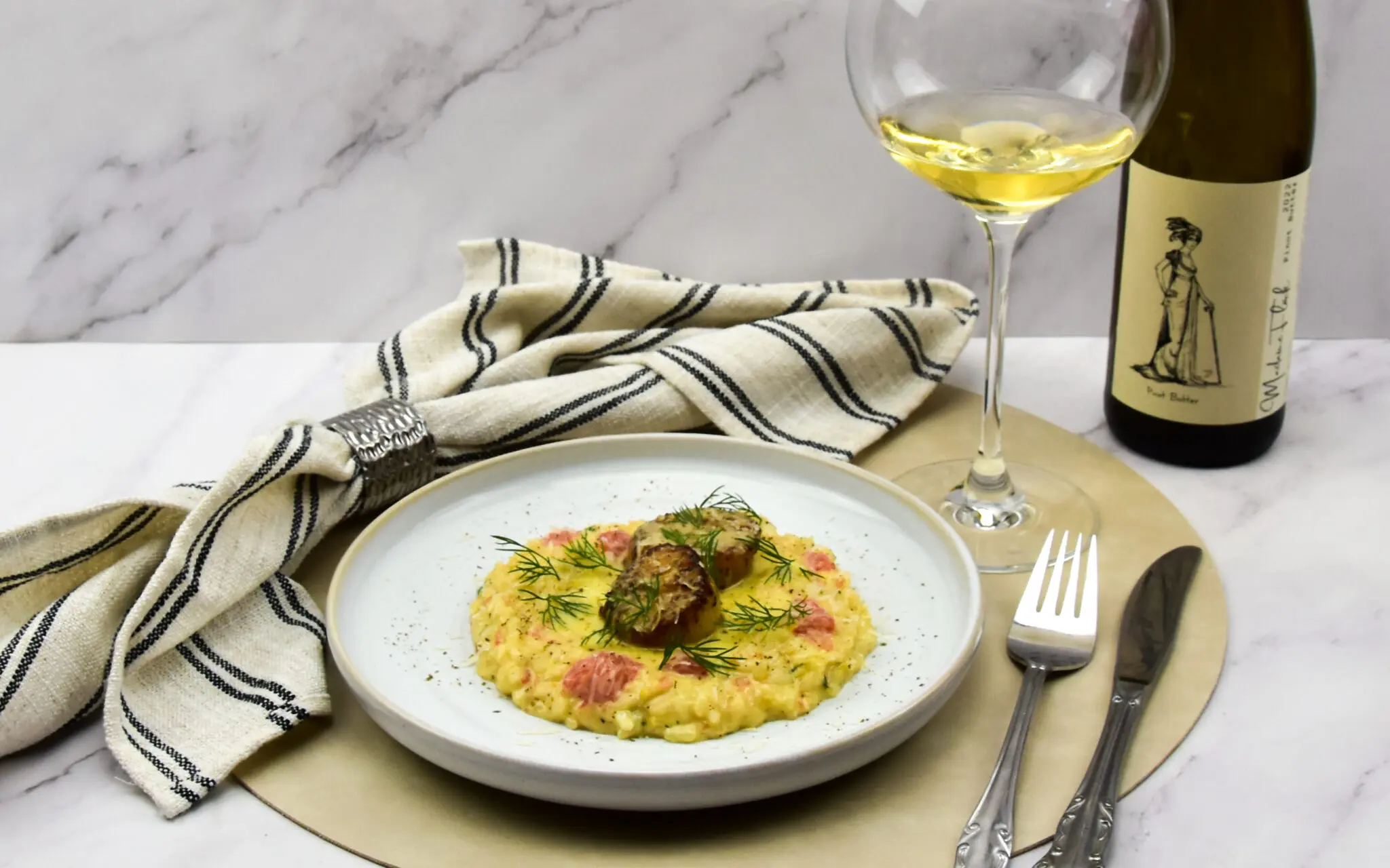 Citrus risotto met coquilles en beurre blanc