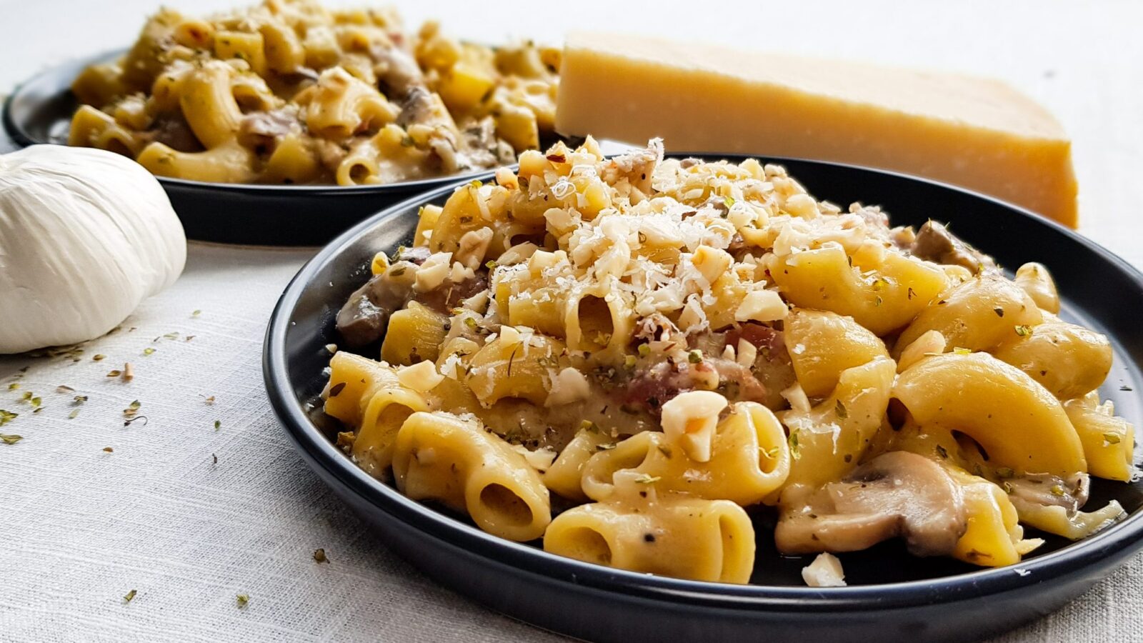 Pasta risottata met kastanjechampignons, pancetta en truffelolie