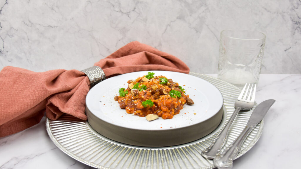 Risotto met bier, chorizo, 'nduja en amandelen