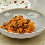 Pasta met romescosaus en Portugees spek